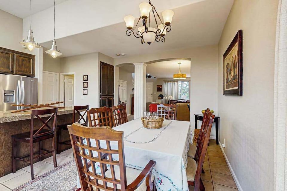 Your open dining and kitchen layout makes entertaining effortless — prep at the granite counter bar while chatting with guests seated at the table.