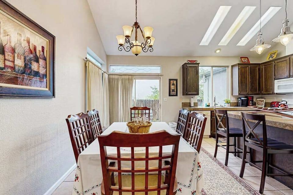 Share farm-to-table meals beneath a skylit ceiling at your formal dining table — wine-themed artwork sets the tone for your Sonoma Valley culinary experience.