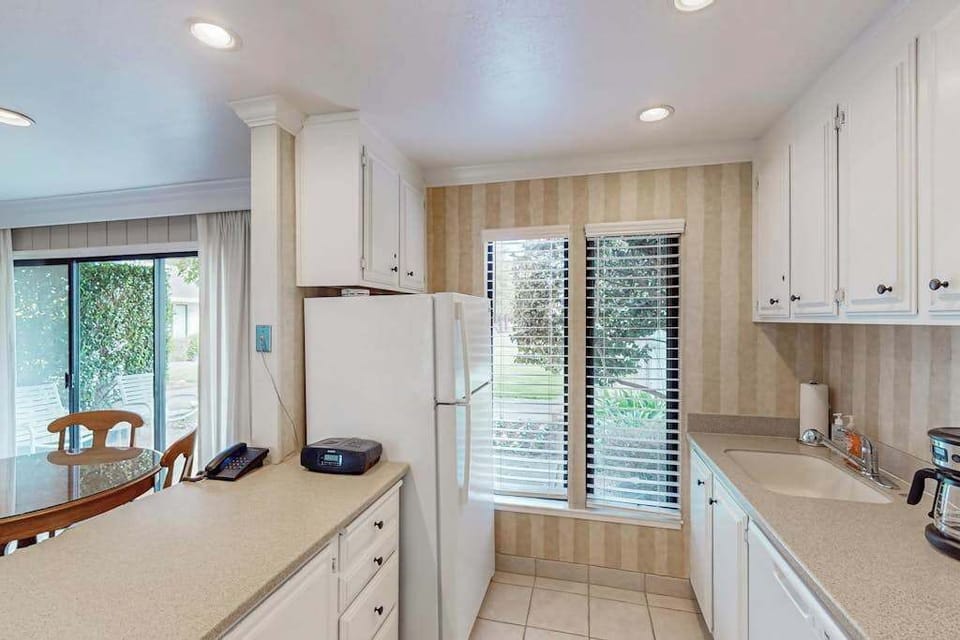 Stock your full-size refrigerator with finds from the Napa farmers market — the galley kitchen connects seamlessly to your dining area