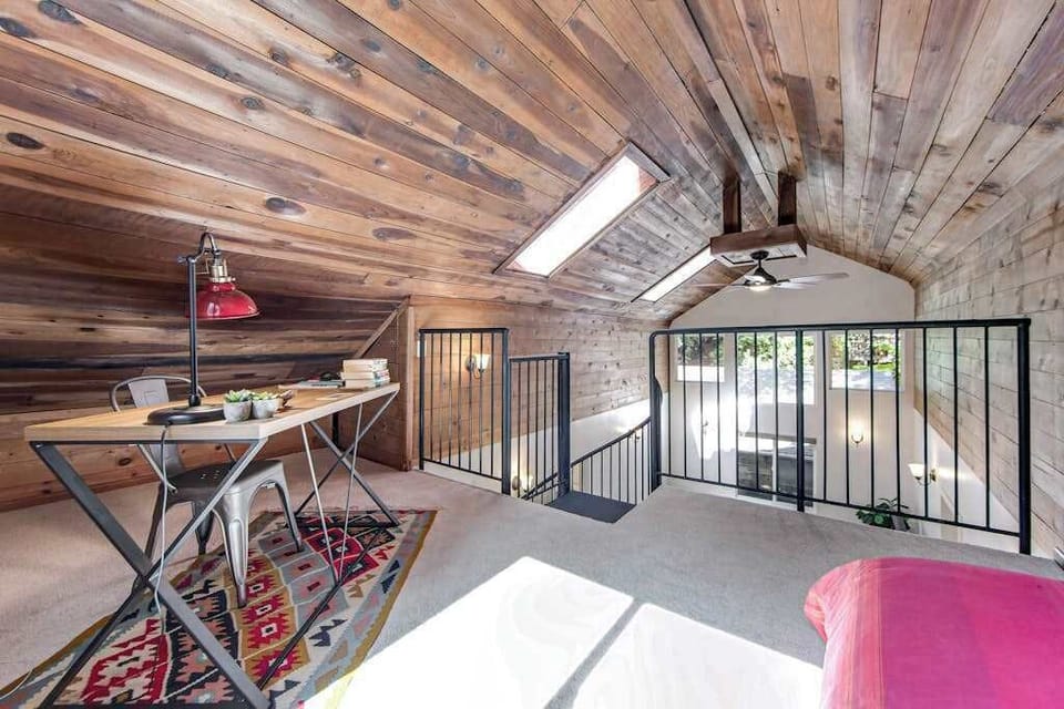 Work or plan your next Sonoma winery visit from the loft desk — a skylight floods the space with natural light while you overlook the living room below.