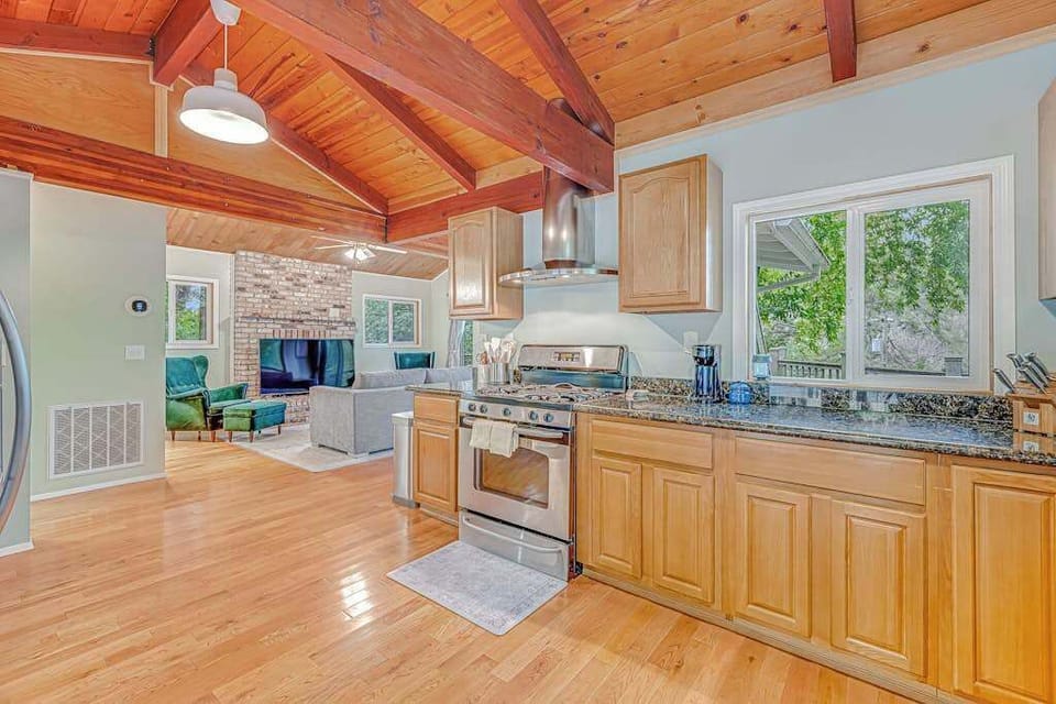 Cook and socialize in your open kitchen that flows into the living room — granite prep space and a pro-style gas range keep every meal effortless.