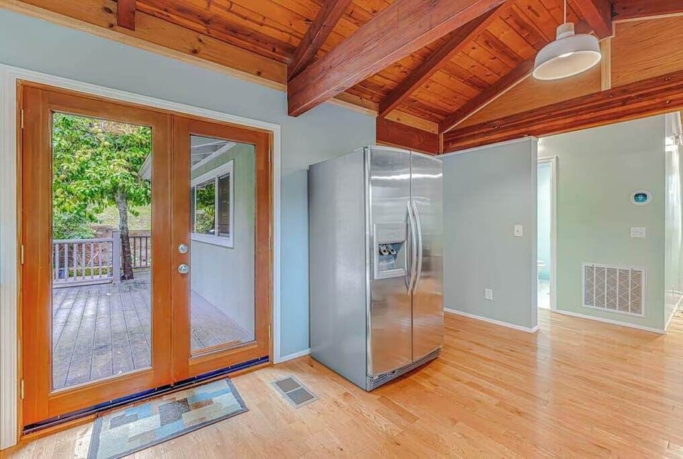 French doors connect your kitchen to a sun-dappled deck — an effortless indoor-outdoor flow that captures the best of Sonoma living.