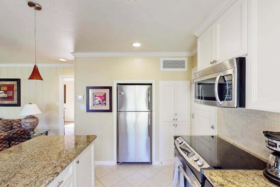 Stock your full-size refrigerator with local Napa Valley cheese and charcuterie — the well-appointed kitchen includes a microwave, oven, and ample granite counter space.