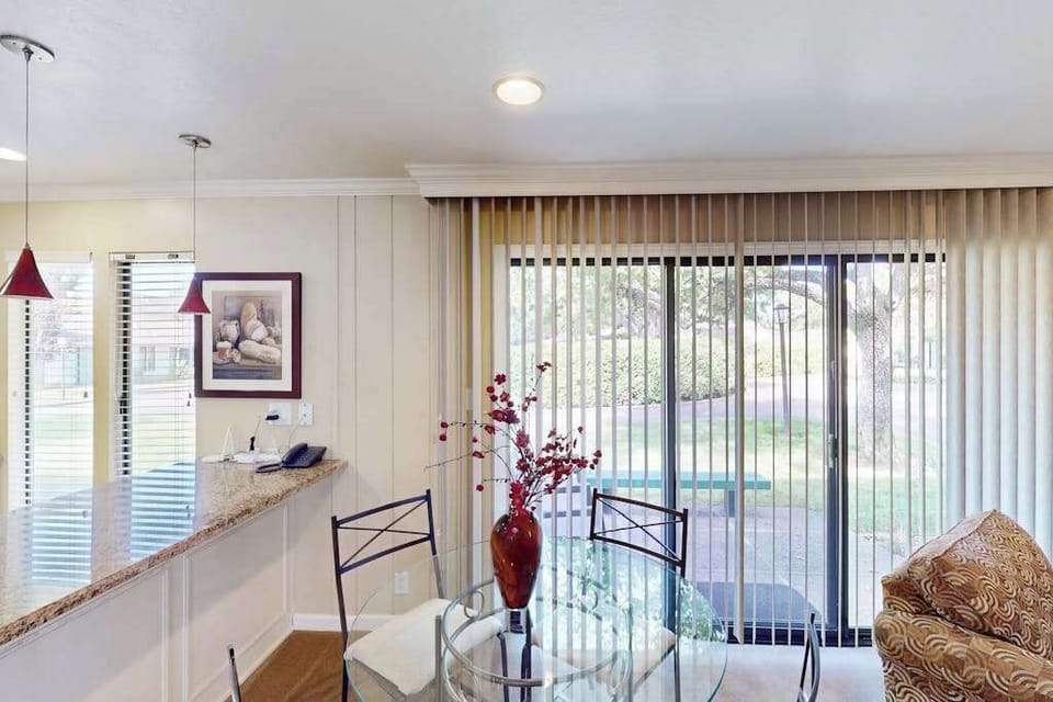 Enjoy morning coffee at your glass-topped dining table with pendant lighting overhead and sliding doors opening to Silverado's manicured Napa Valley golf course grounds.
