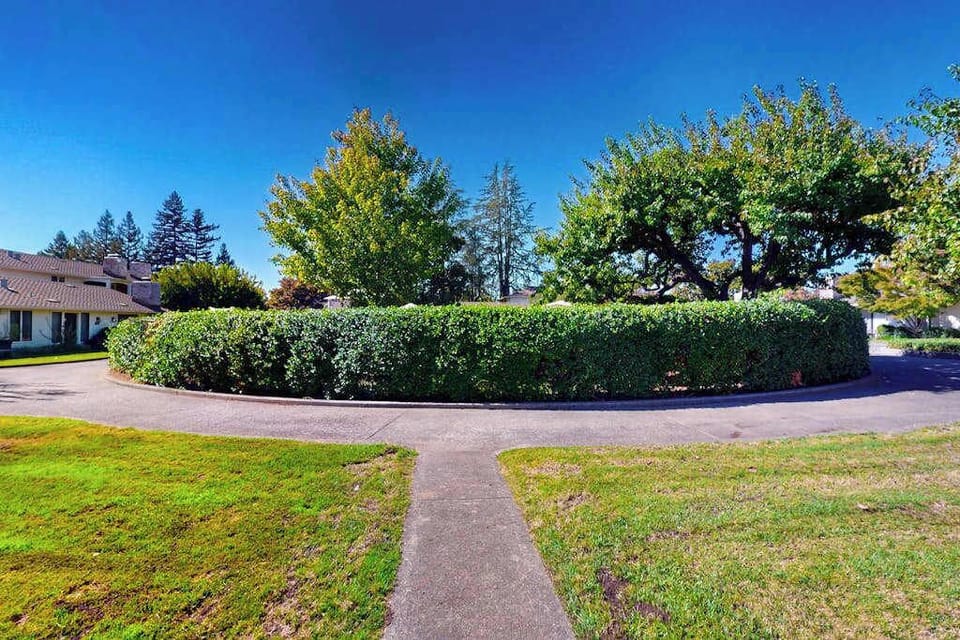 Stroll along beautifully landscaped pathways through the Silverado Resort — manicured hedges and mature trees create a serene Napa Valley escape right outside your door.