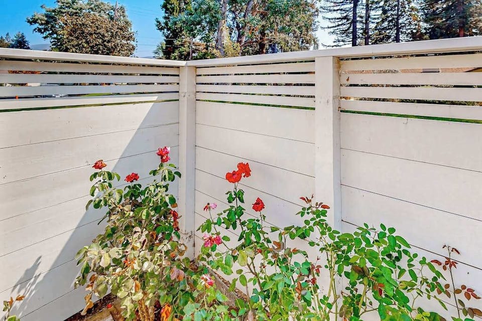 Roses bloom along your private fence line, adding a touch of Napa Valley charm and color to your enclosed garden patio.