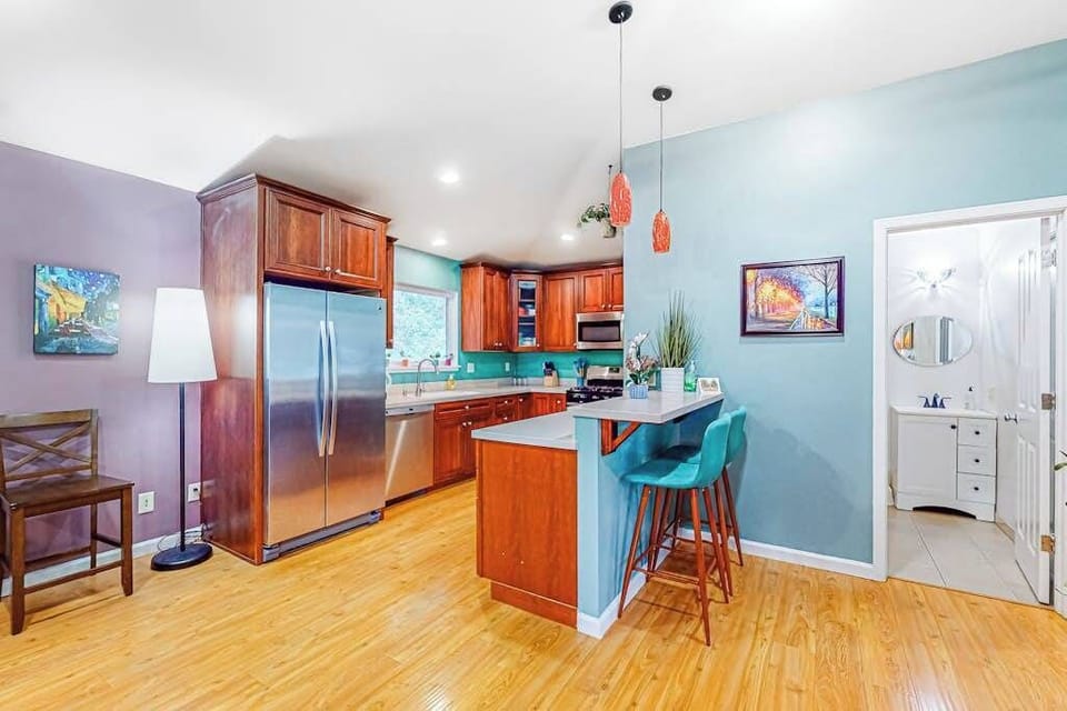 Channel your inner chef in this gorgeous kitchen with cherry cabinets, a breakfast bar, and stainless steel appliances — your redwood retreat has serious culinary chops.