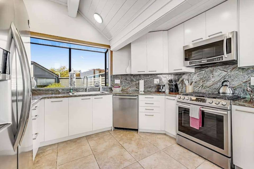 Whip up Sonoma Coast seafood feasts in your fully equipped kitchen with stainless steel appliances, marble backsplash, and views to the garden
