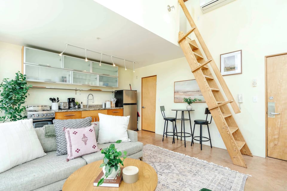 Airy loft layout with ladder access + dining nook