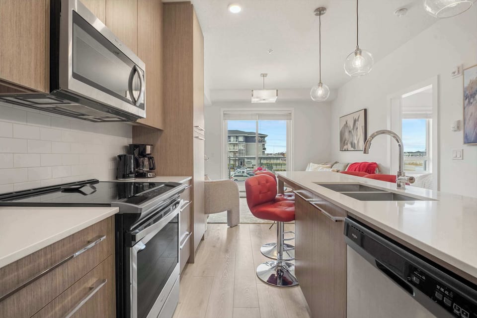 Sleek kitchen with stainless steel finishesSleek kitchen with stainless steel finishes