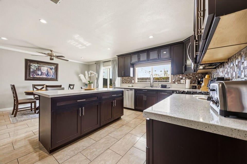 Gather around the elegant dining table, open to our fully equipped modern kitchen and spacious island.