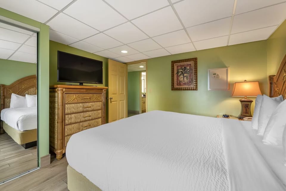 Stretch out with fresh linens, TV, and restful lighting.