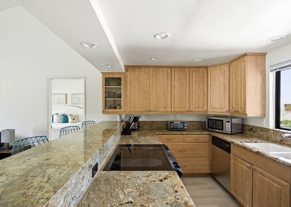 Open kitchen layout makes entertaining simple and enjoyable.