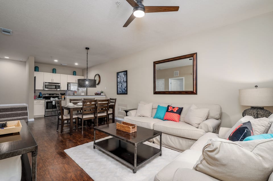 Open layout connecting living room, dining, and kitchen areas