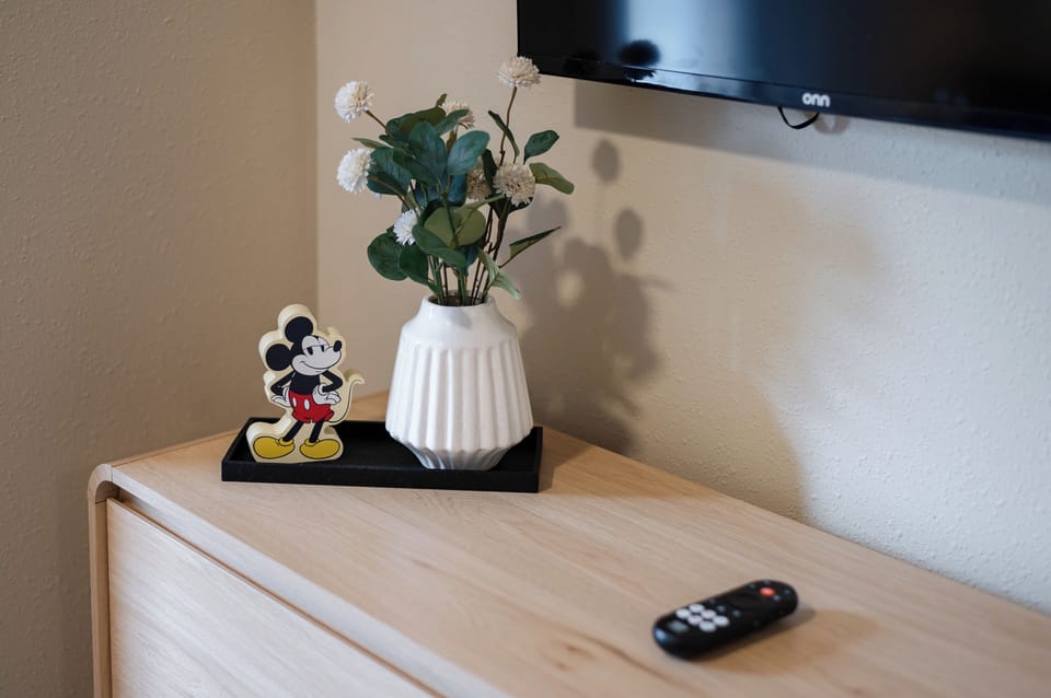Thoughtfully styled bedroom with charming Disney touches throughout