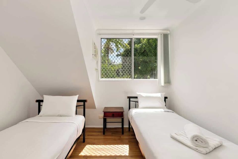 The second bedroom comes with two single beds, ideal for those travelling in a group or with kids.
