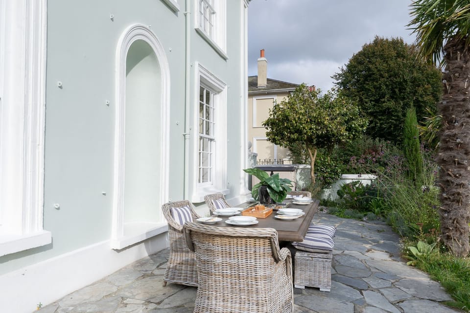 Outdoor dining table on garden patio  - Castle Lodge