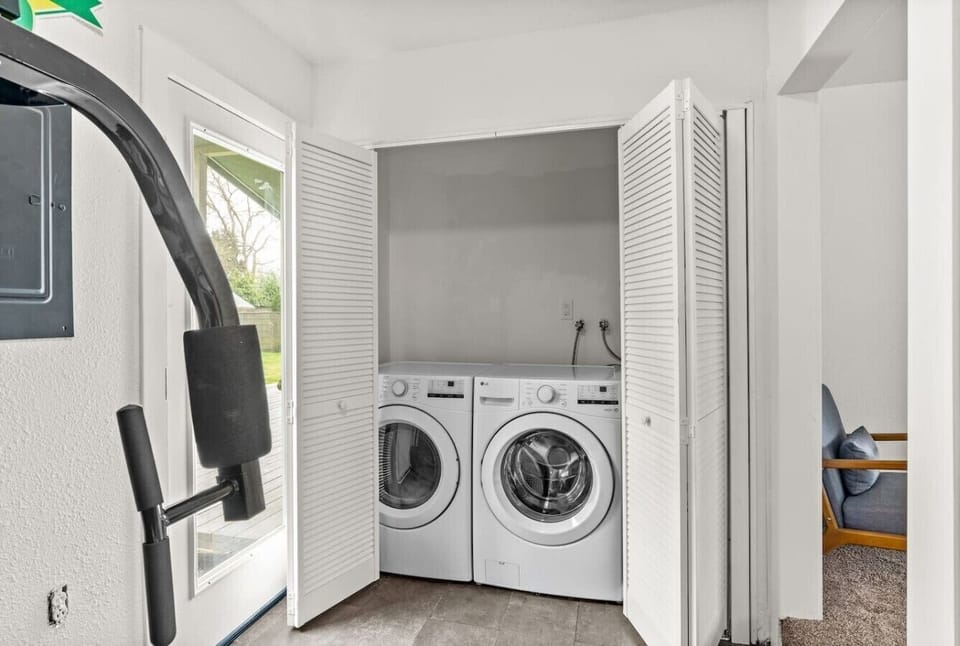 Tucked-away laundry closet keeps your stay stress-free with washer and dryer access.