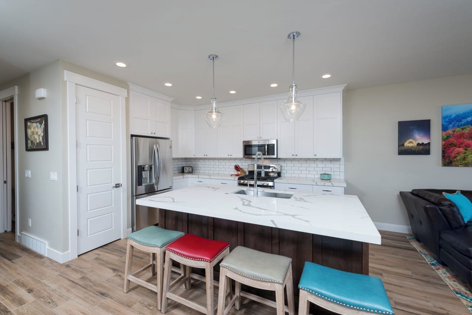 Fully stocked gourmet kitchen with modern finishes and room to create