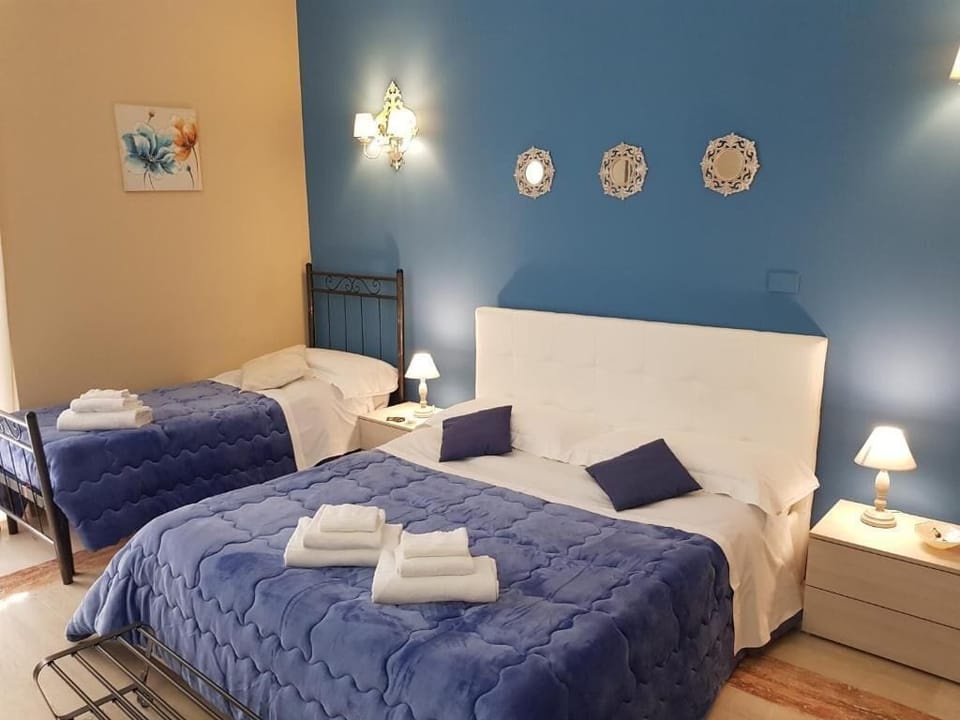 Basic Quadruple Room, Balcony, City View | In-room safe, soundproofing, iron/ironing board, free WiFi