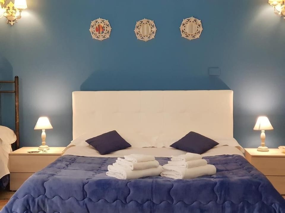 Basic Quadruple Room, Balcony, City View | In-room safe, soundproofing, iron/ironing board, free WiFi