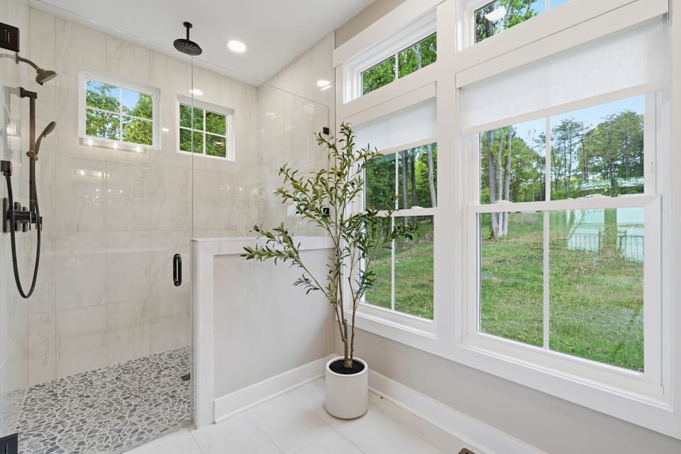 Luxury Bathroom Retreat: Experience elegance with airy views and sleek finishes for your refresh!
