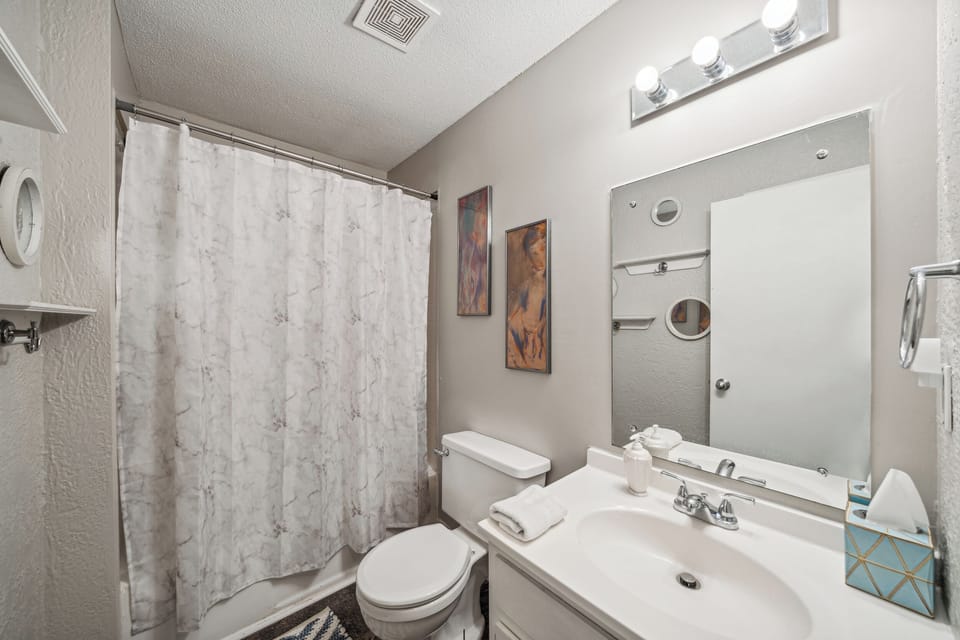 The bathroom offers a full tub/shower.
