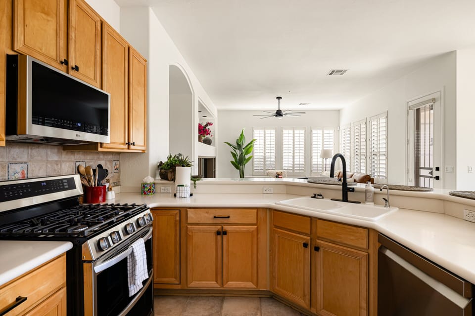 Enjoy a well-appointed kitchen with modern appliances, generous counter space, and an open view into the living area for easy cooking and connection.