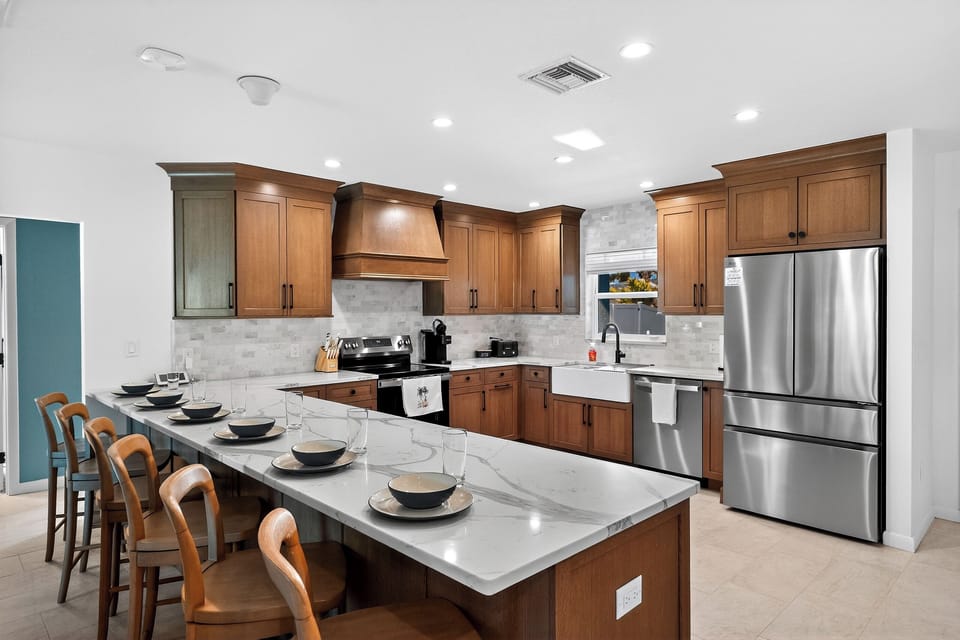 The fully renovated kitchen offers ample space for preparing meals for large groups.