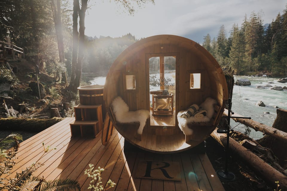 Warm cedar, soft light, and the river flowing just outside.