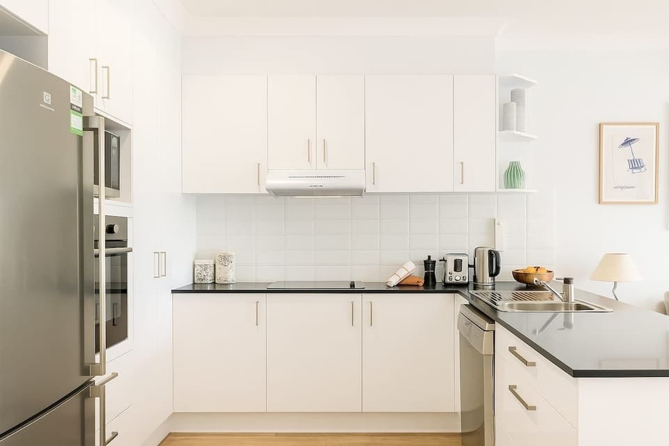 Fully Equipped Kitchen – Cook with ease using microwave, dishwasher, and modern appliances.