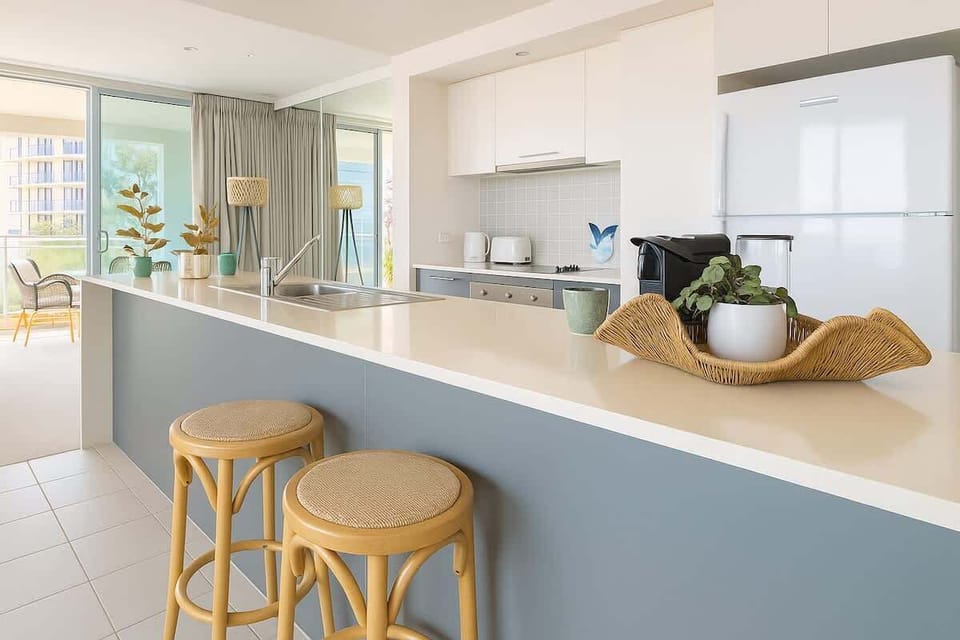 Kitchen
Modern, fully equipped kitchen with island bench, perfect for family meals or easy breakfasts before a beach day.