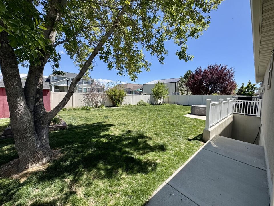 Fully fenced backyard you can use (the hot tub and fire pit are here)