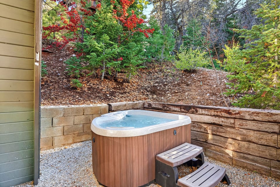 Private hot tub tucked into a peaceful, wooded setting.