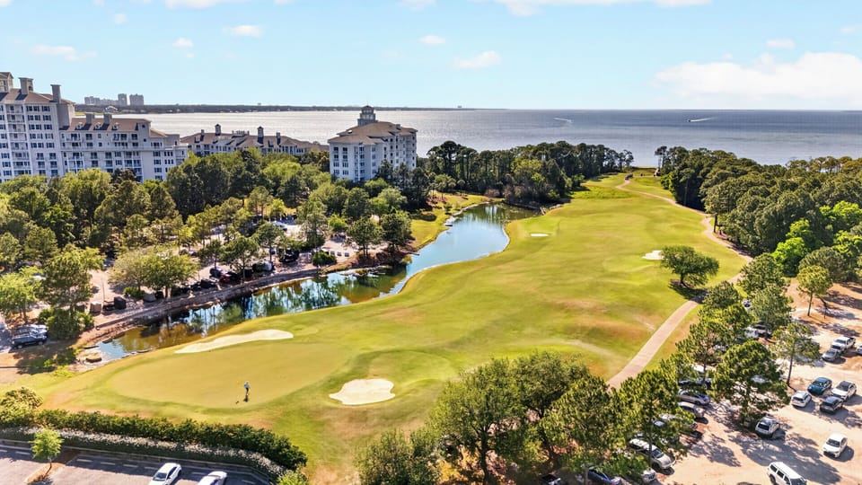 Golf course greens and winding waterways.