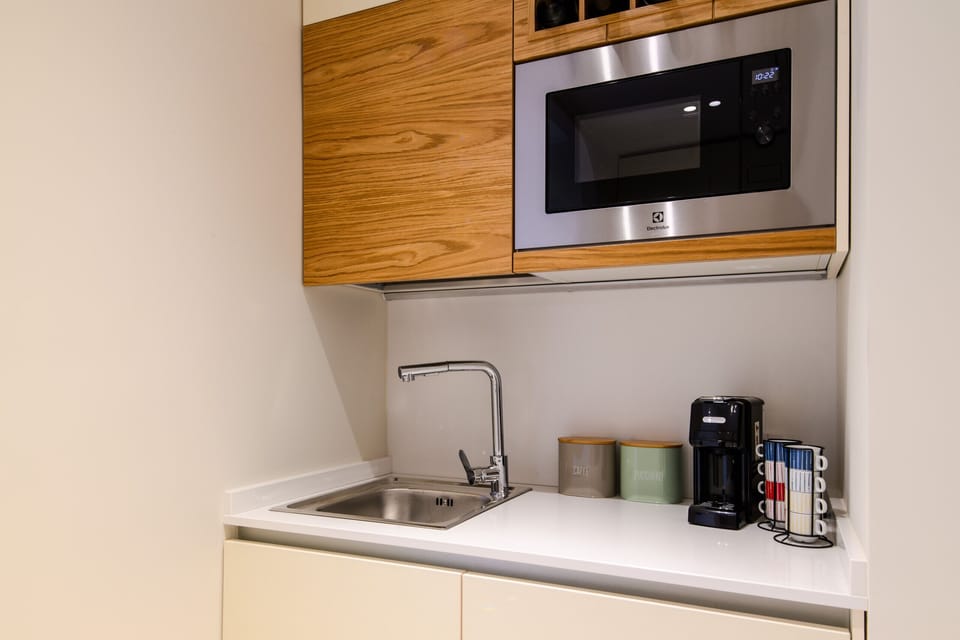 Coffee/tea maker, microwave, dishwasher, cookware/dishes/utensils