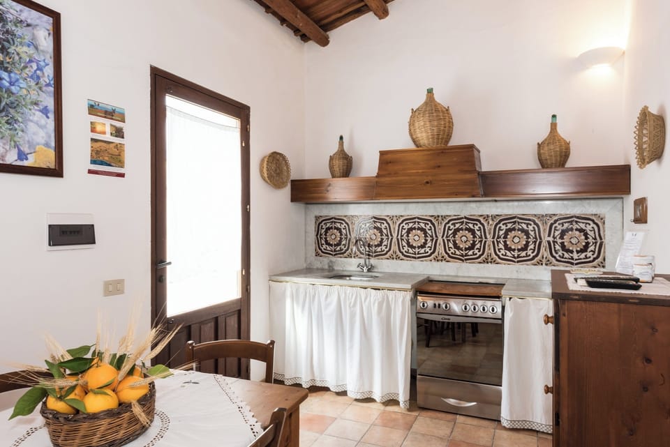 Family Apartment, Patio, Courtyard View | Private kitchen | Espresso maker, electric kettle