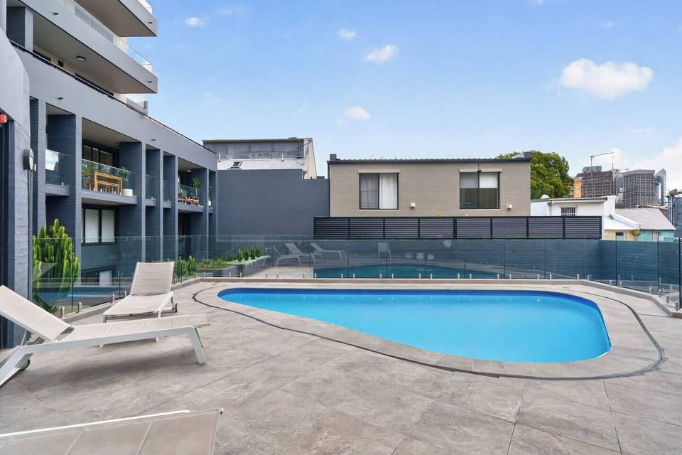 Slip into the shared pool and enjoy a quiet, refreshing pause, offering a calm escape within the building.
