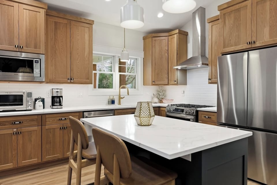 Chef’s kitchen is fully stocked, with generous storage throughout.