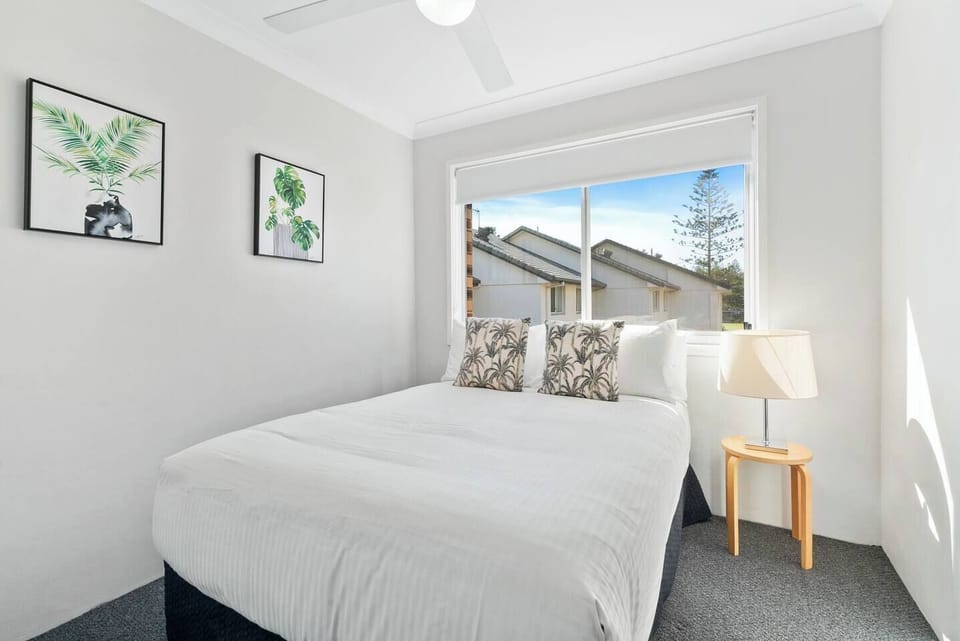 Settle into the second bedroom's double bed and enjoy a cosy atmosphere that offers a comfortable place to recharge after a long day out.