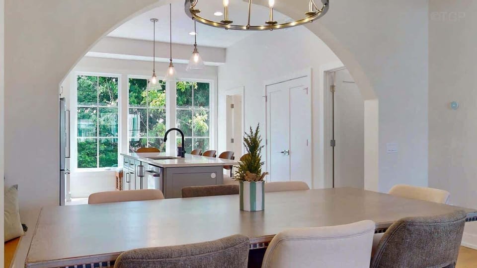 Dining table seats 8 with additional seating at the kitchen island