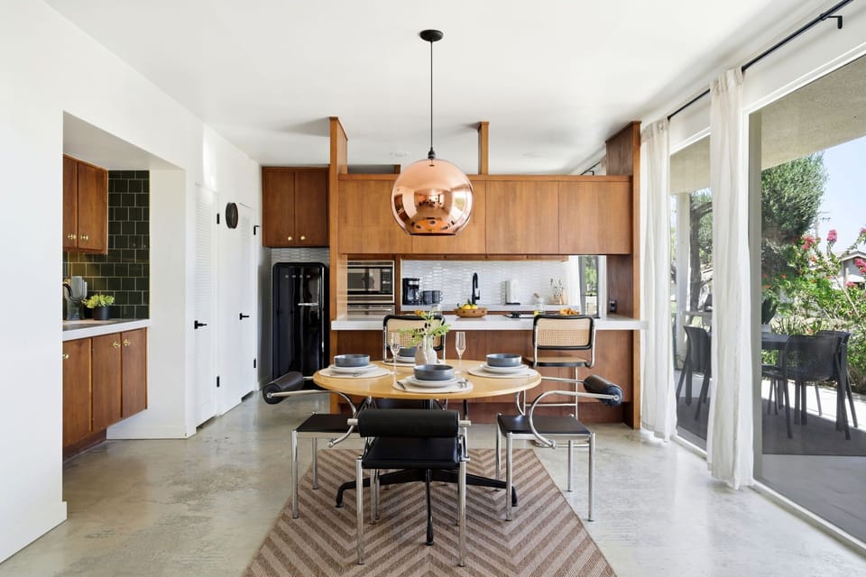 Clean and functional kitchen with essential cookware, appliances, and plenty of space to prepare meals.