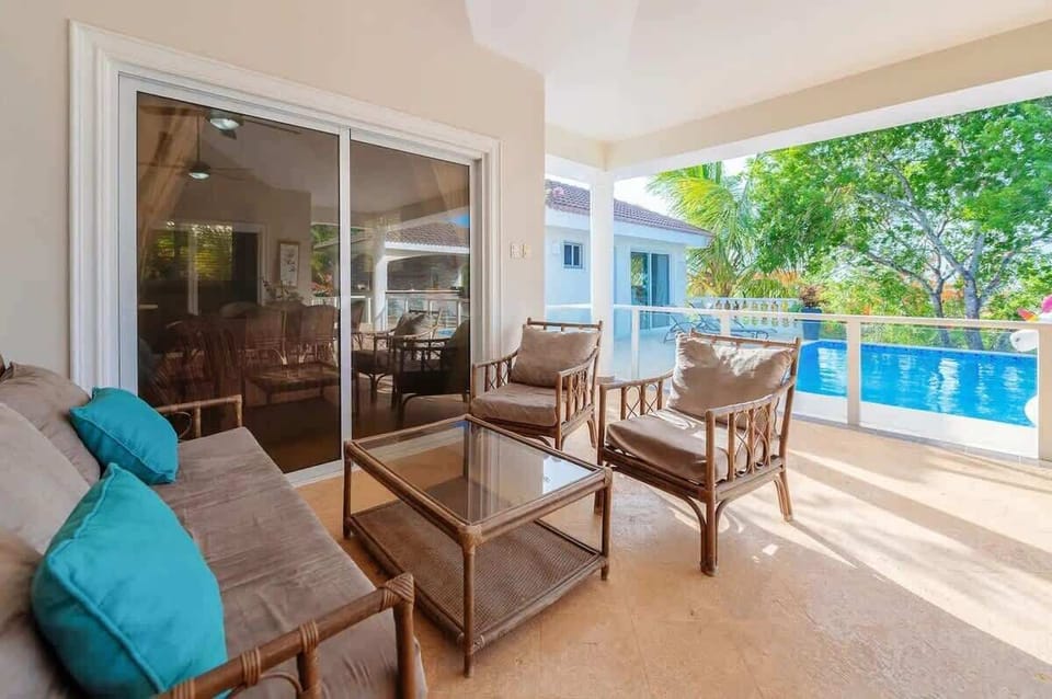 Small furniture next to the pool.