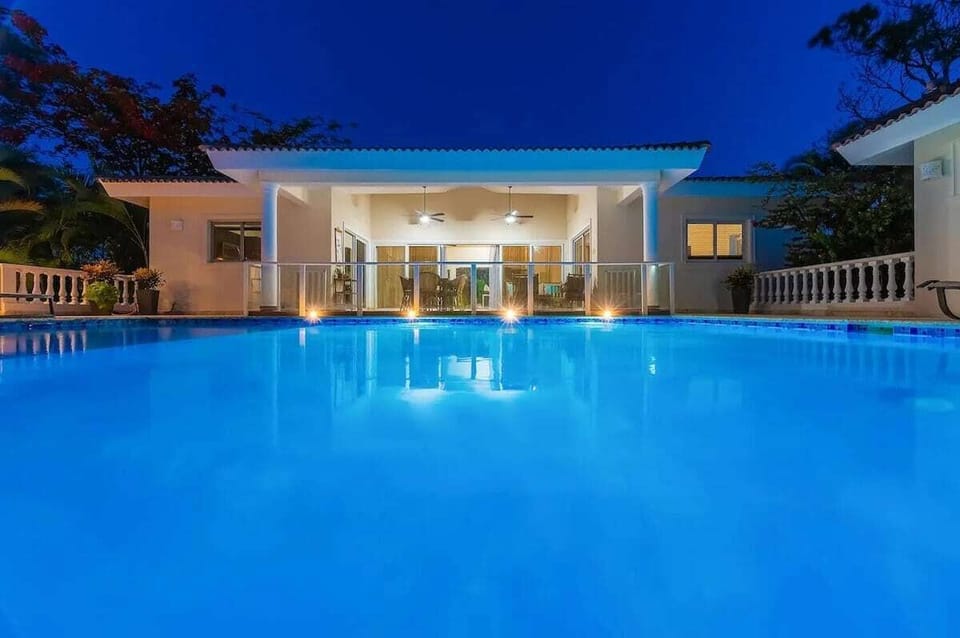 Pool with crystal-clear water and ocean view.
