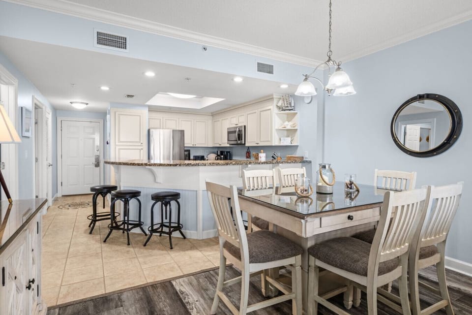 Dining area with seating for six, perfect for family meals just steps from the beach.