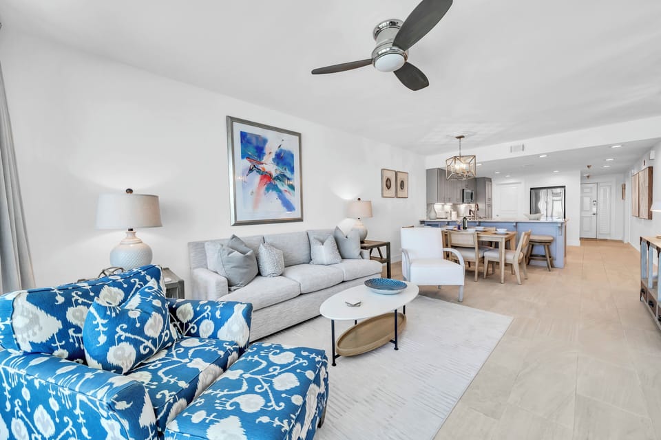Relax in your bright, airy living space with coastal-inspired furnishings and an open layout that flows seamlessly into your modern kitchen.