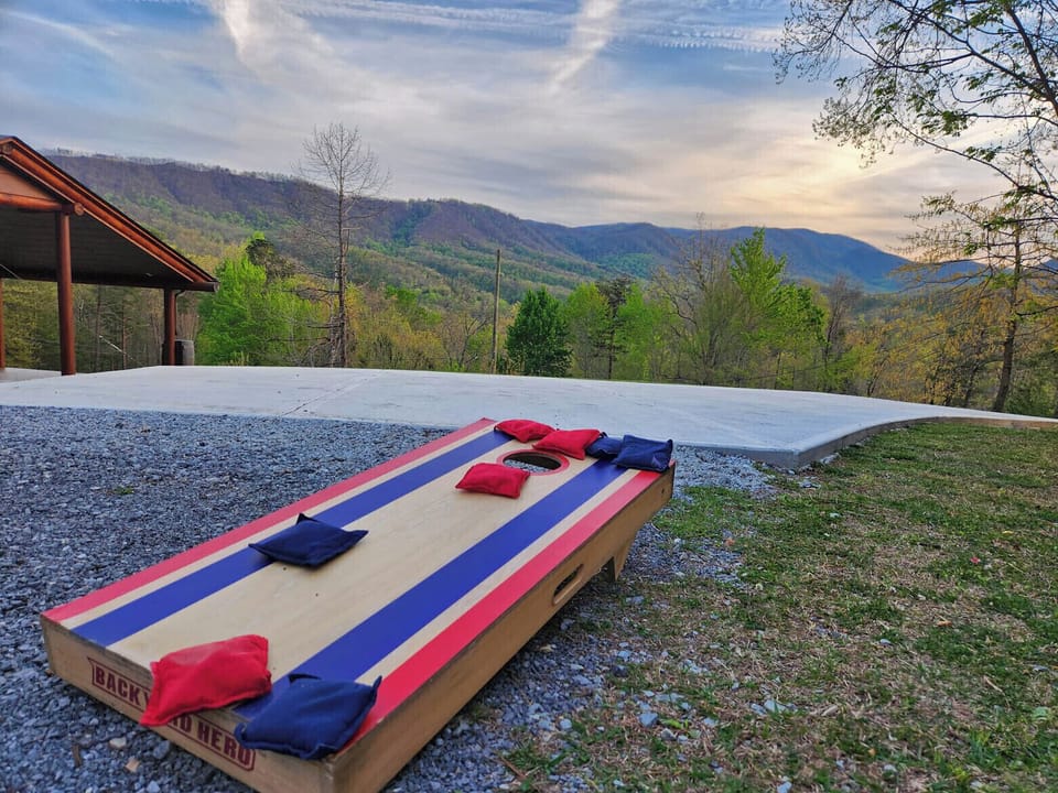 Mountain-view cornhole setup with sunset scenery and room to unwind