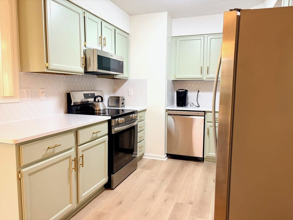 New Kitchen Appliances and Countertops and Refinished Cabinetry
