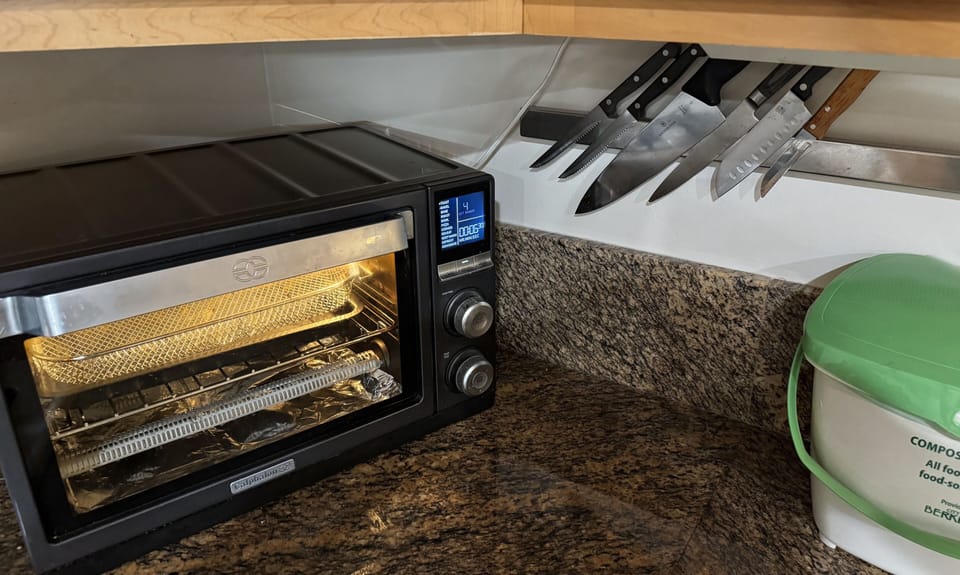 Multi-function toaster oven w/light. You may even bake or cook a 12" Pizza