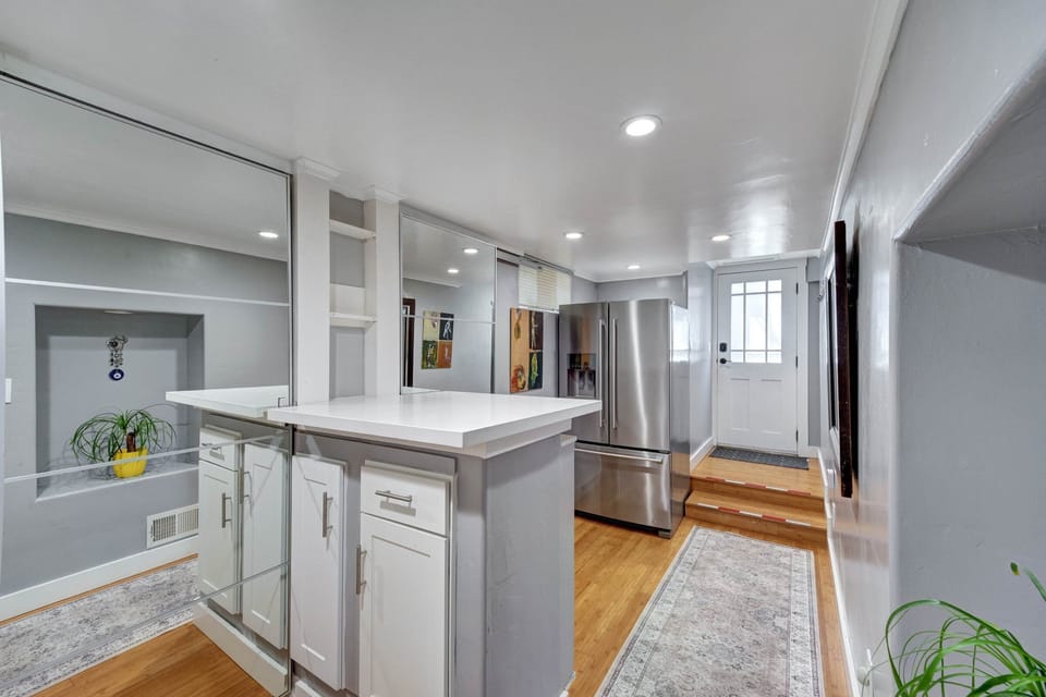 Another view of the entrance, a nice counter top next to the washer & dryer